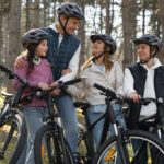 full-shot-family-cycling-together